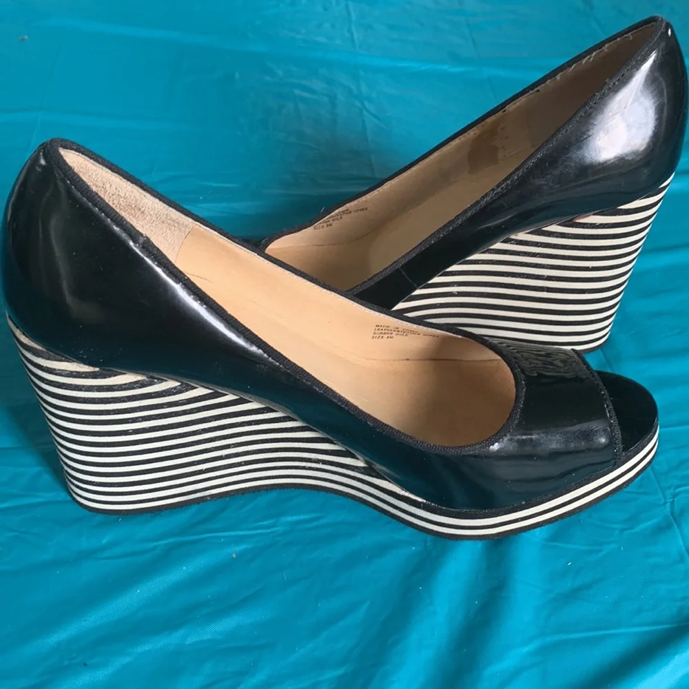 Gently worn Michael Kors Adlai’s Black and Cream Strip Wedge Shoes.